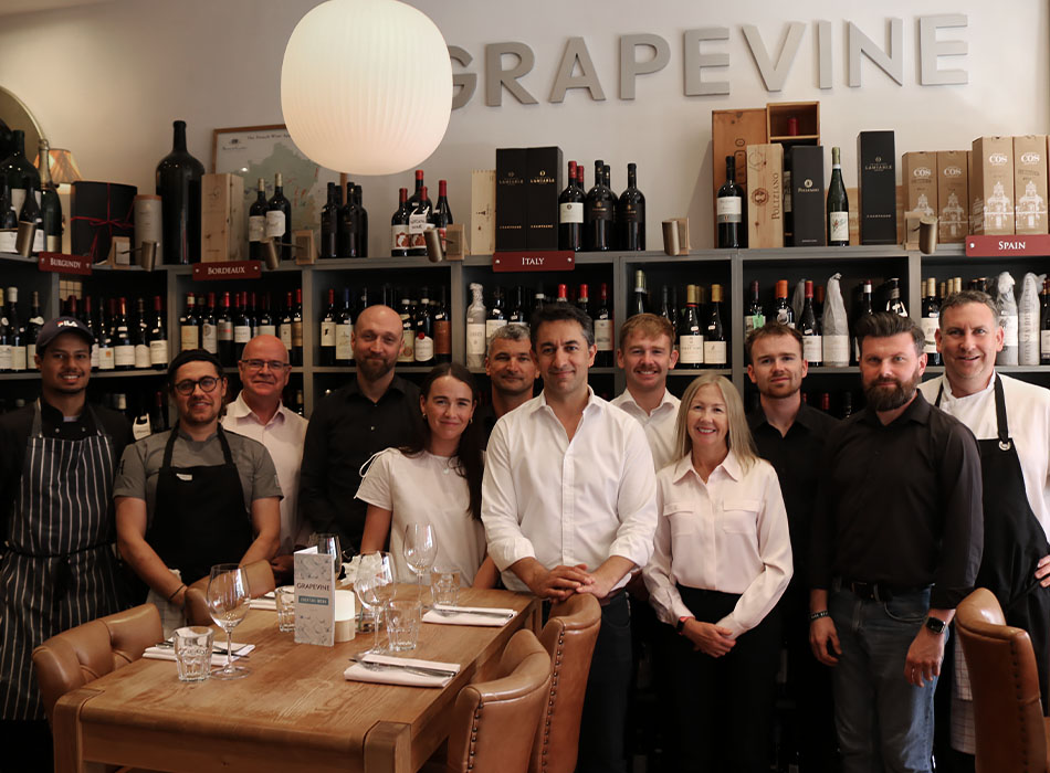 Grapevine Team Photo in front of reserved table - Grapevine Dalkey Restaurant and Wine Bar